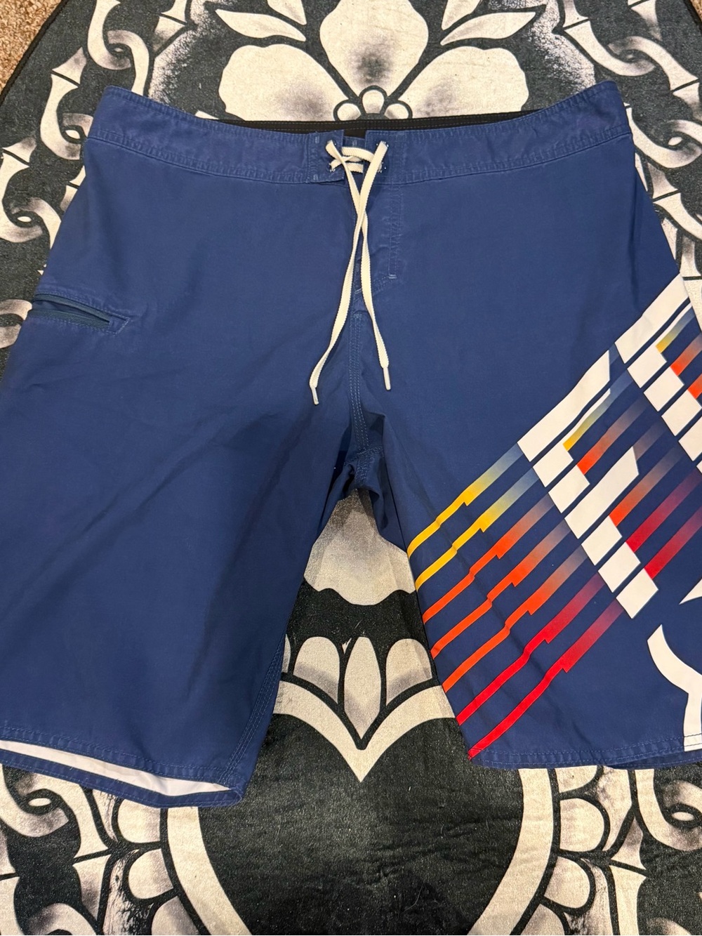 FOX Men's Blue Swim Trunks with Multicolor Stripe Accent